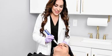 Close up of a lovely caucasian woman having microdermabrasion non invasive therapy with derma pen in a Medical Spa | Vita Aesthetics in Sarasota, FL